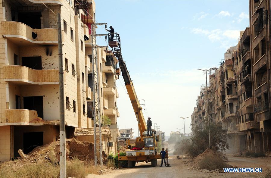 SYRIA-DAMASCUS-DARAYA-PEOPLE-RETURN-HOME