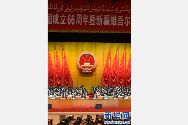 10月1日，慶祝中華人民共和國成立66周年暨新疆維吾爾自治區(qū)成立60周年大會在新疆人民會堂隆重舉行。 新華社記者 高潔 攝 