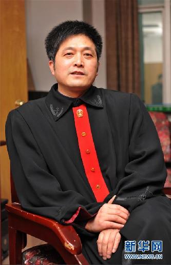 （圖文互動）其人如蘭，既潔且馨——追記“全國模范法官”胡國運