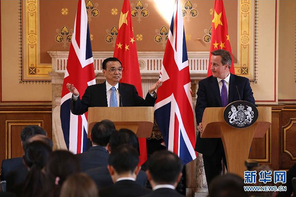     6月17日，國務(wù)院總理李克強(qiáng)同英國首相卡梅倫在倫敦舉行中英總理年度會(huì)晤后共同會(huì)見記者。 新華社記者 龐興雷 攝 